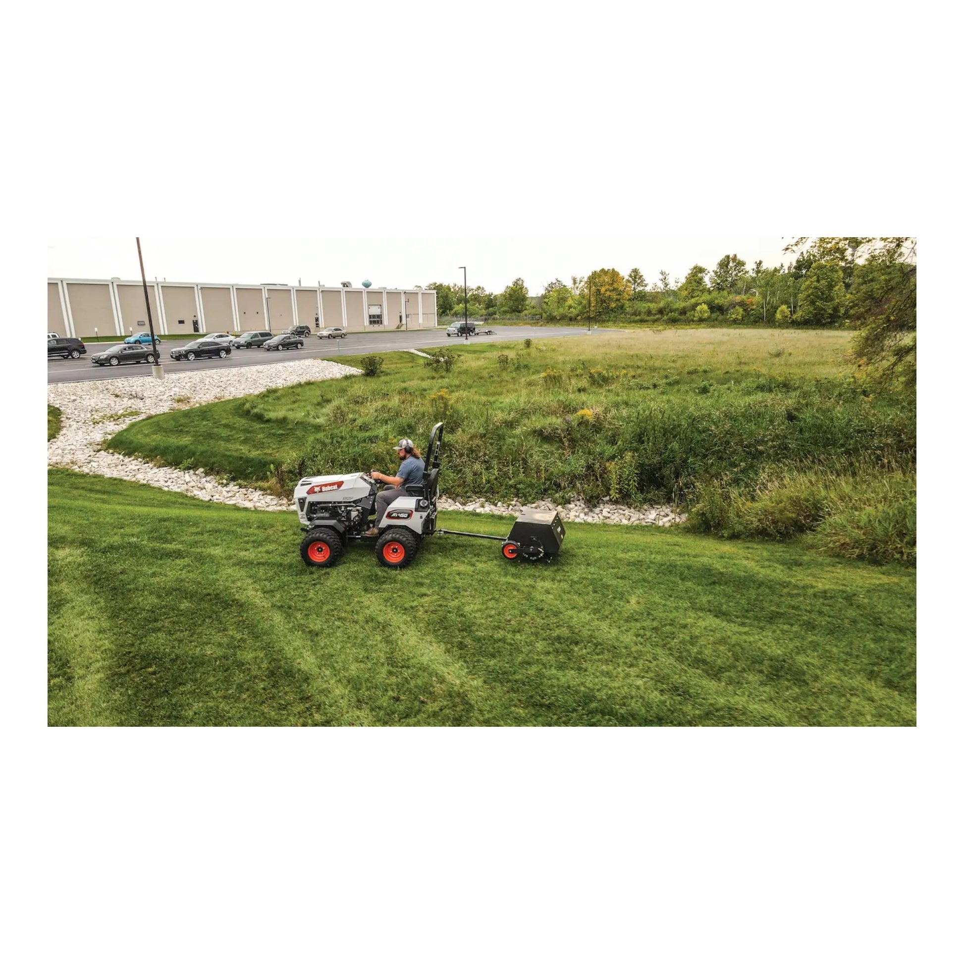Bobcat AE36 36-inch tow-behind aerator with 4-wheel design, heavy-duty tines, and commercial durability