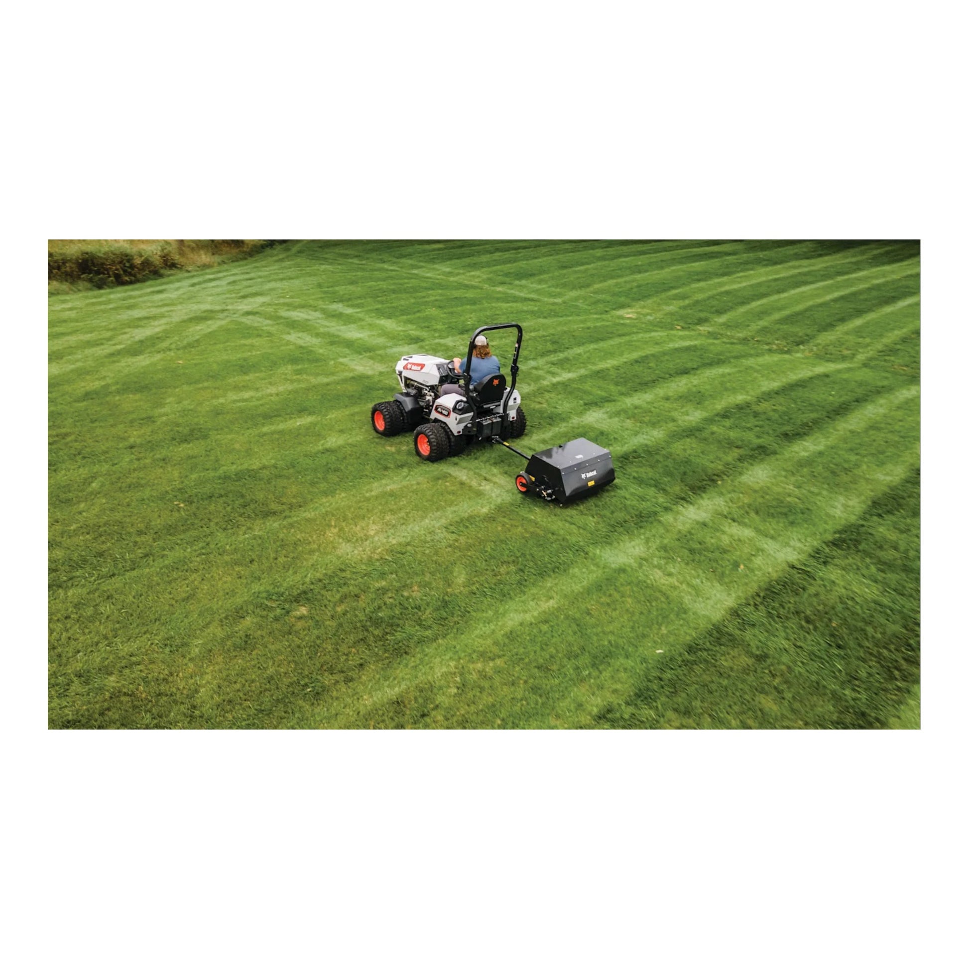 Bobcat AE36 36-inch tow-behind aerator with 4-wheel design, heavy-duty tines, and commercial durability