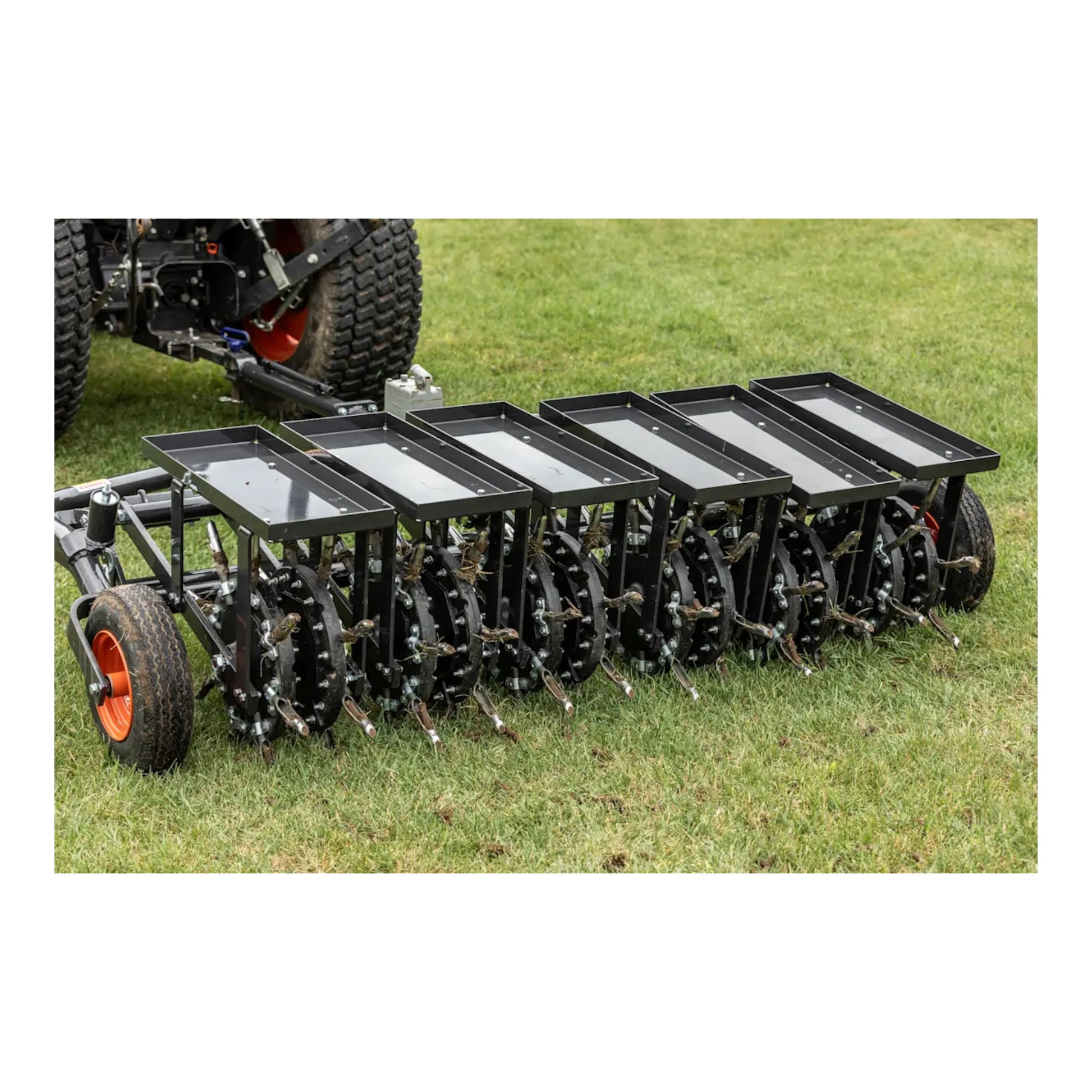 Bobcat AE72 72-inch tow-behind aerator with dual-axle design, commercial-grade tines, and high-productivity coverage