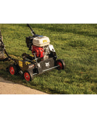 Bobcat DT18 18-inch push dethatcher with rugged tines and manual pull-behind design