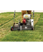 Bobcat DT18 18-inch push dethatcher with rugged tines and manual pull-behind design