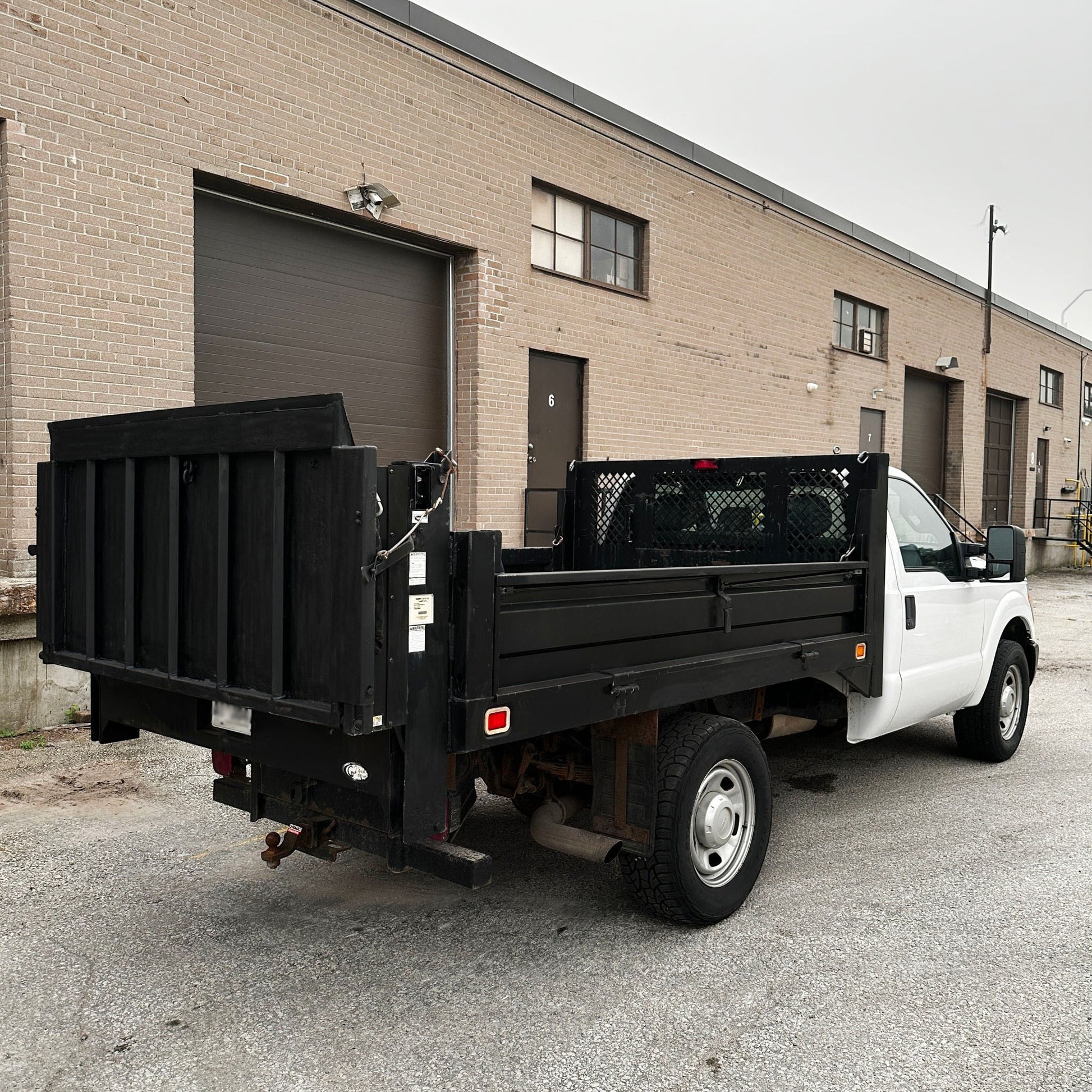 2012 Ford F-350 Flatbed Truck with Drop-Down Side Rails and Hydraulic Liftgate J